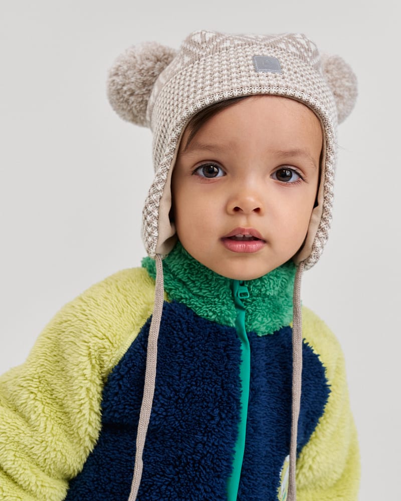 Ullue med ører og øreklaffer med vindstoppere | Kuuru