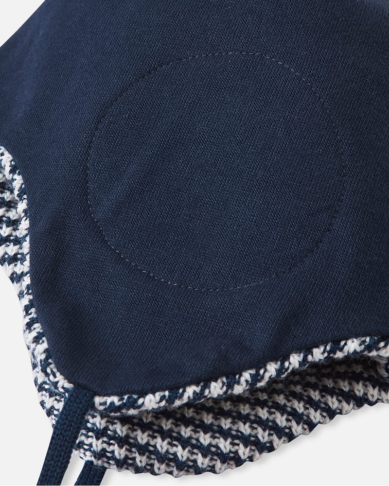 Ullue med ører og øreklaffer med vindstoppere | Kuuru